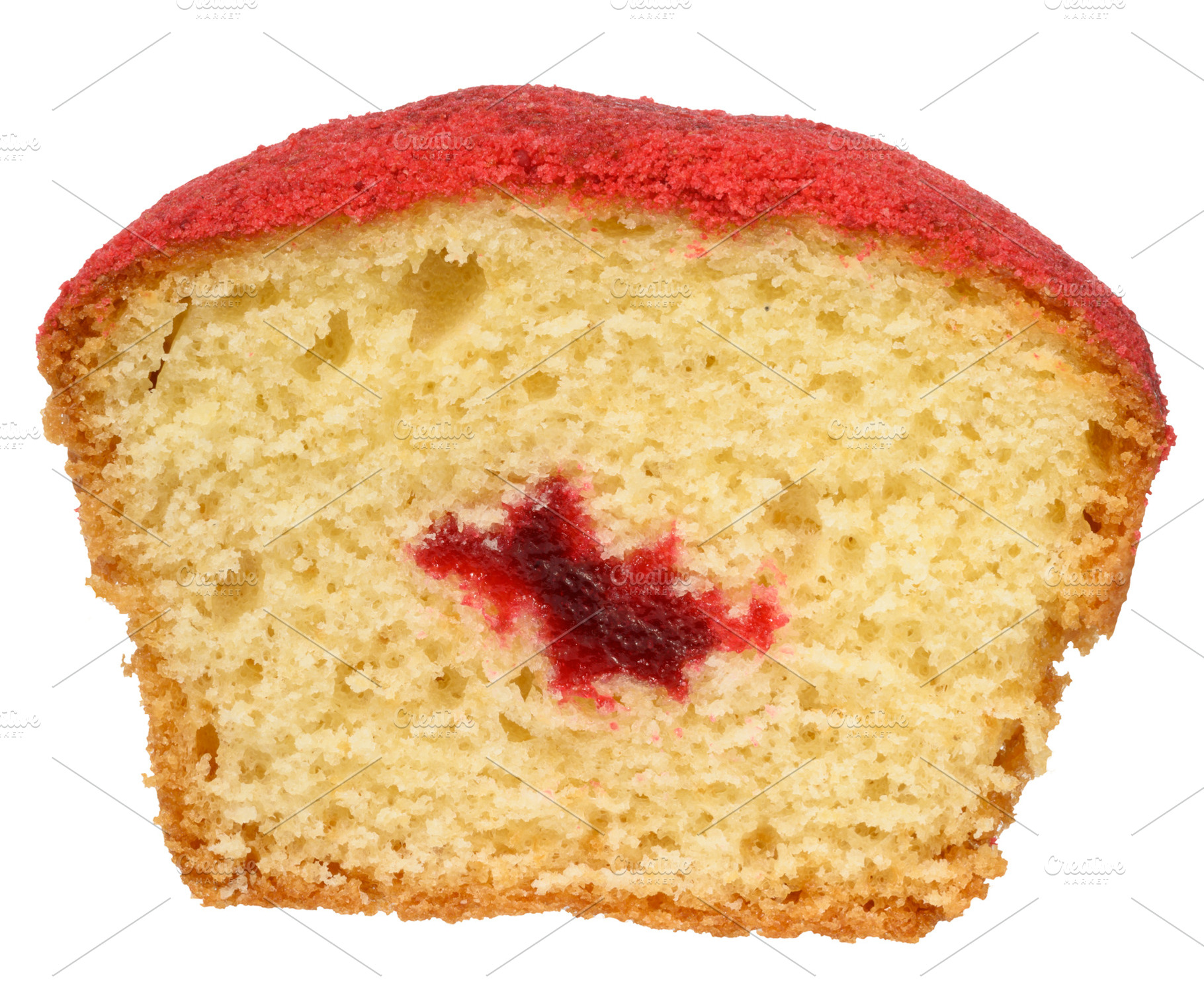 A cross section of a baked muffin red, jam filling visible in th, a Food & Drink Photo by ndanko