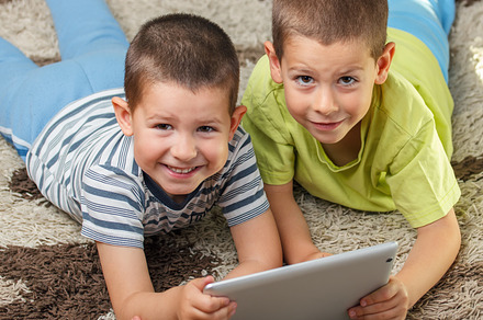 Boys using electronic tablet preview 6