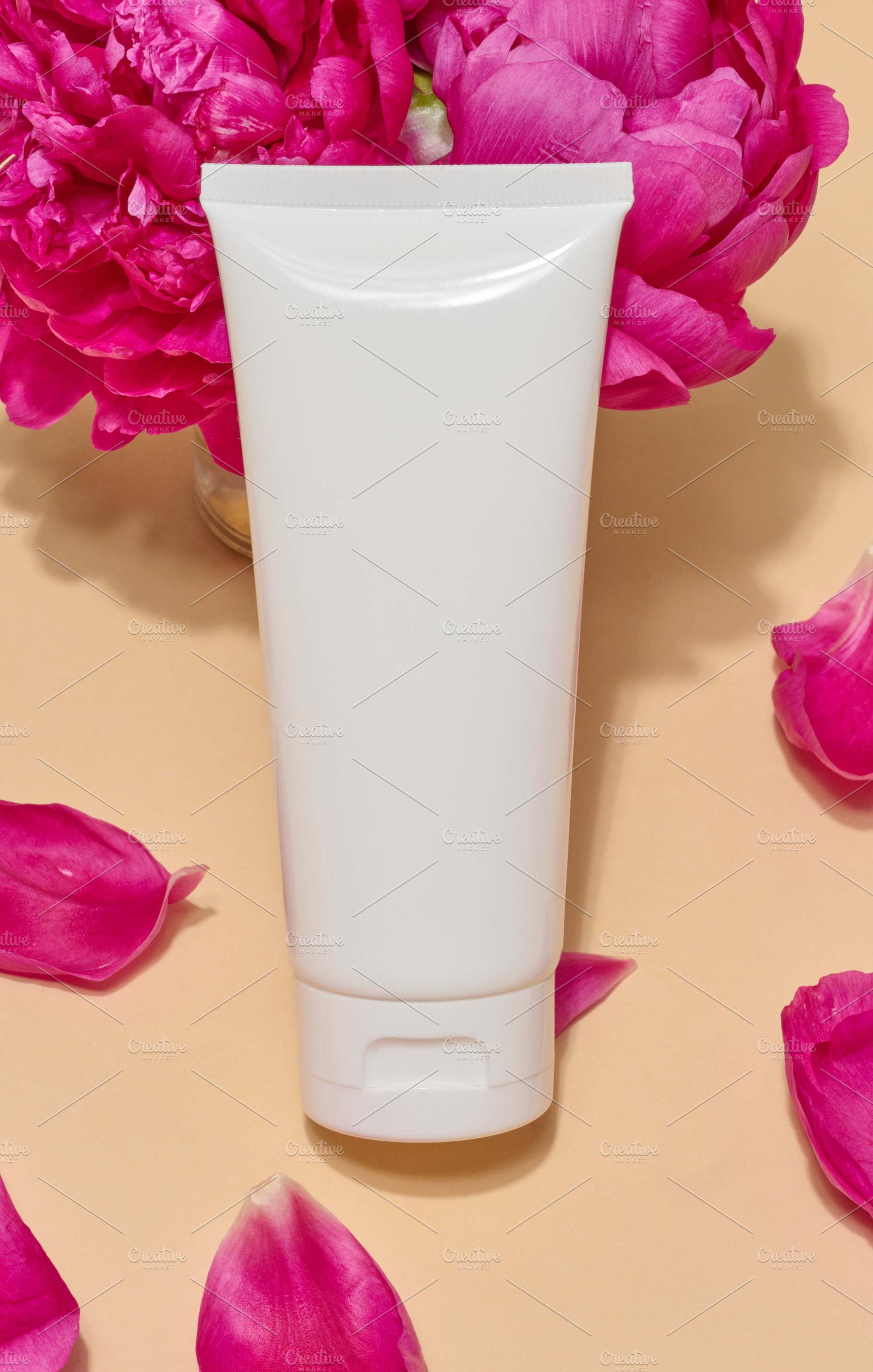 Close-up of white cosmetic tube without label surrounded by brig, a Beauty & Fashion Photo by ndanko