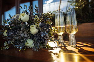 Wedding bouquet and champagne glasses with golden light, a Holiday Photo by Red Hot Chili Pepper Shop