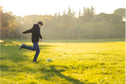 A boy kicks a soccer ball in a field, a Sports & Recreation Photo by Barcelona_dreams