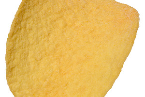 Close up of one saddle shaped potato chip isolated on background, a Food & Drink Photo by ndanko