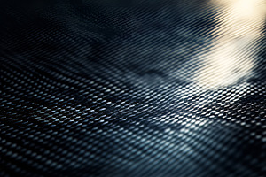 Abstract texture of a dark, reflective surface with intricate patterns., a Background Photo by ImageMir
