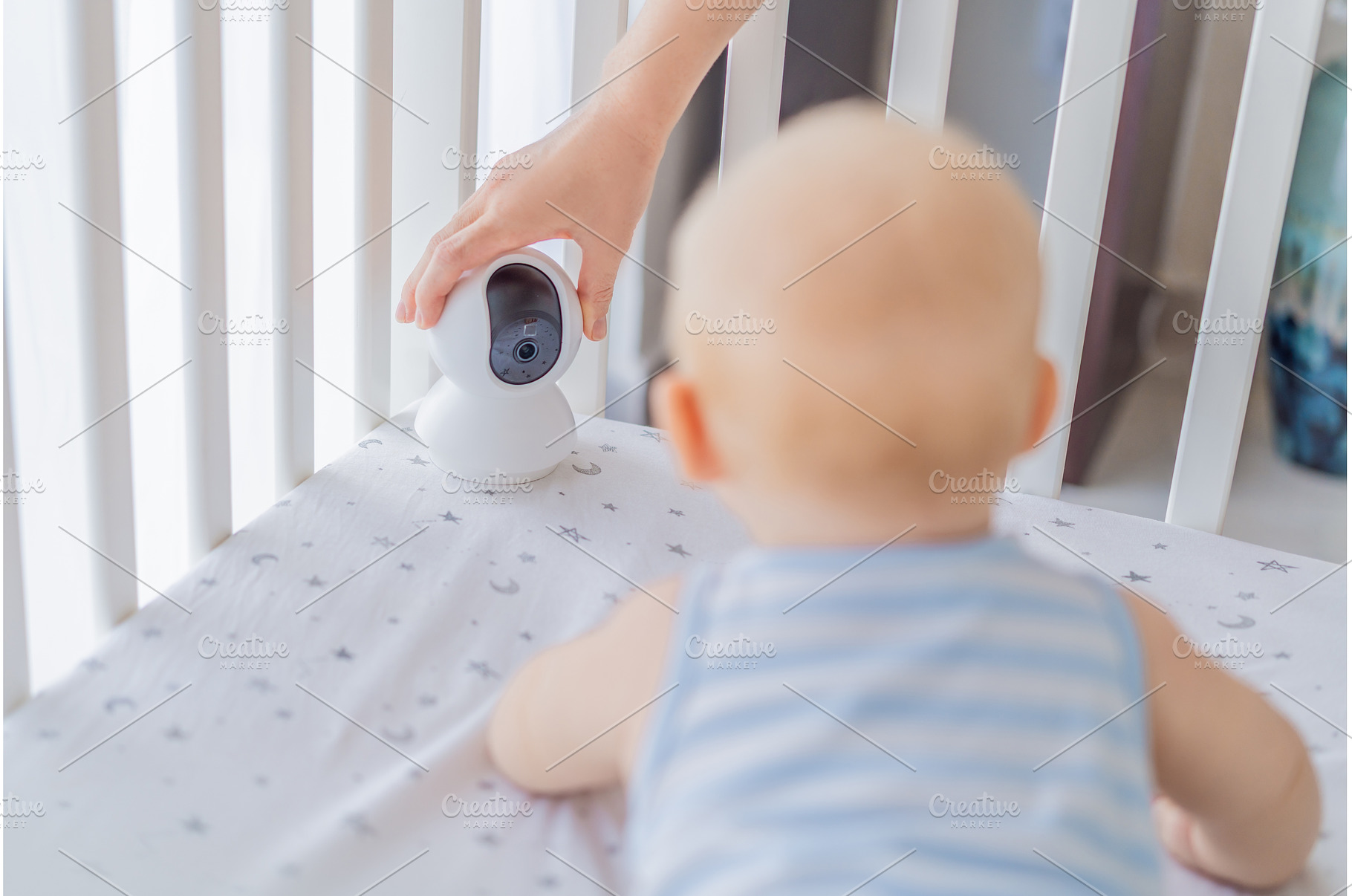 Baby monitor camera placed inside a, a Technology Photo by Elizaveta Galitskaya