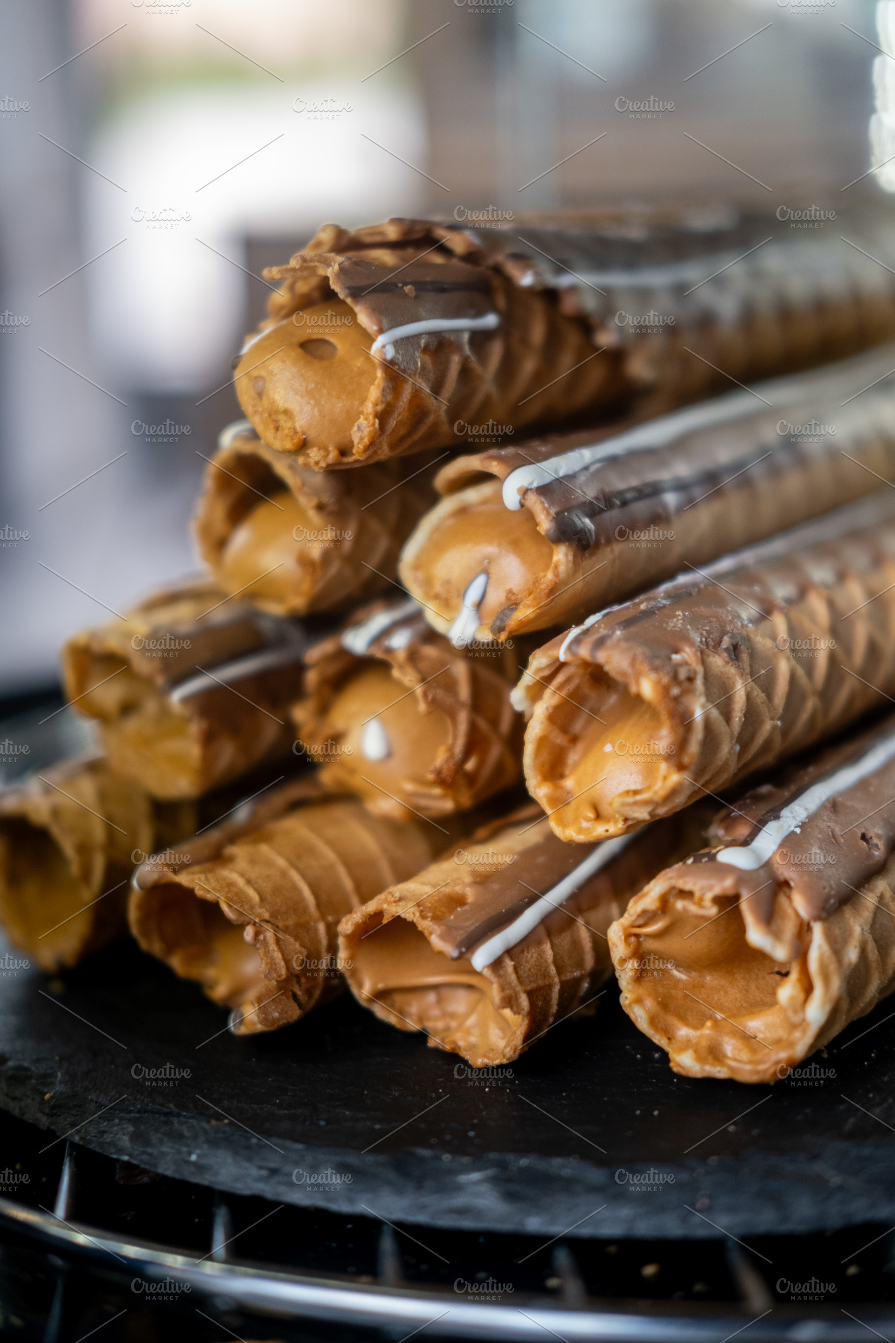Waffles tube crispy cream cookie stacked pile, a Food & Drink Photo by Photo Drive Studio