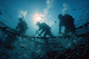Scuba Divers Working Underwater Nett, a Photo by Pixeness Studio