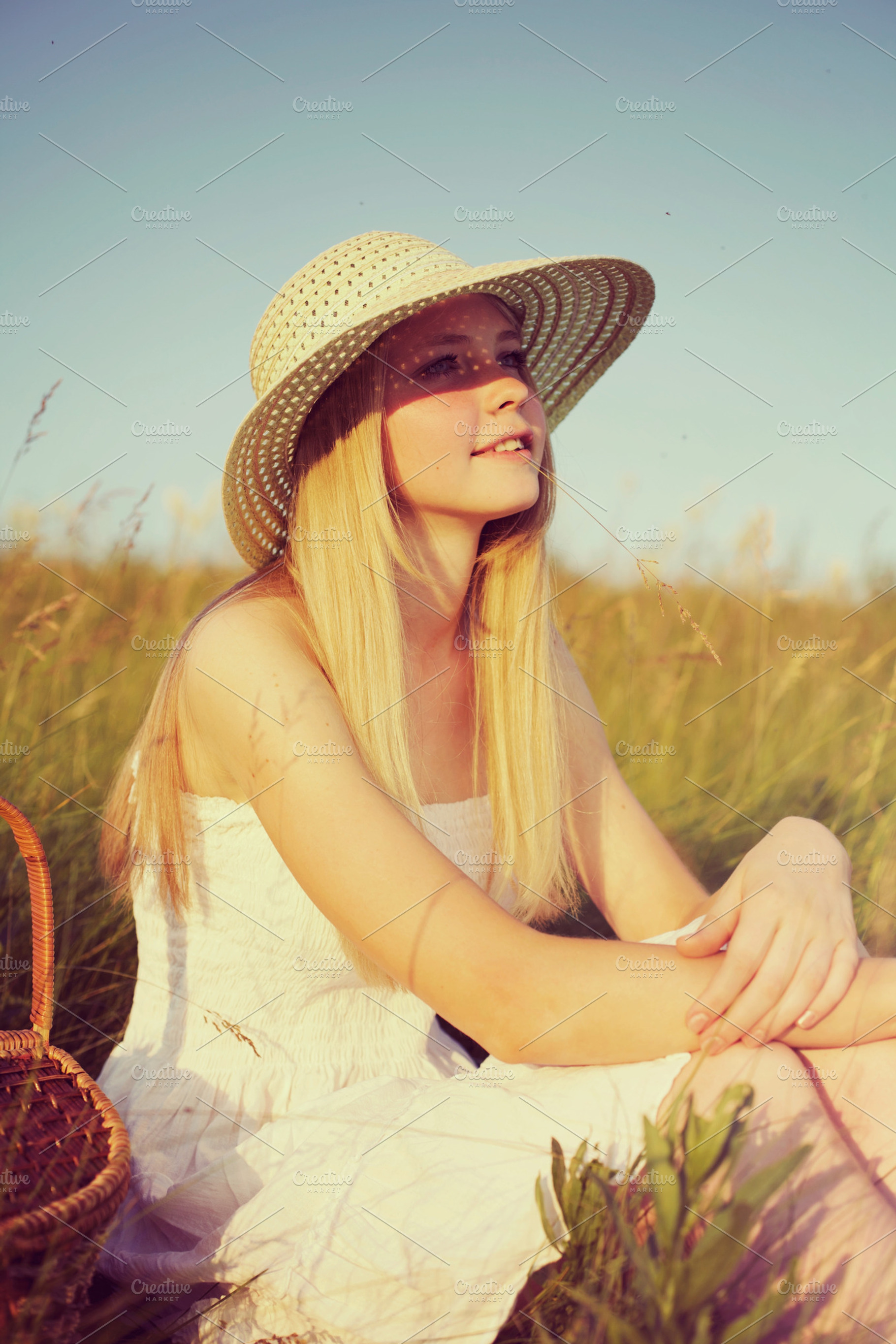 Girl sitting on meadow