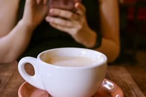 Cozy cafe scene with a steaming cup, a Food & Drink Photo by Sir13