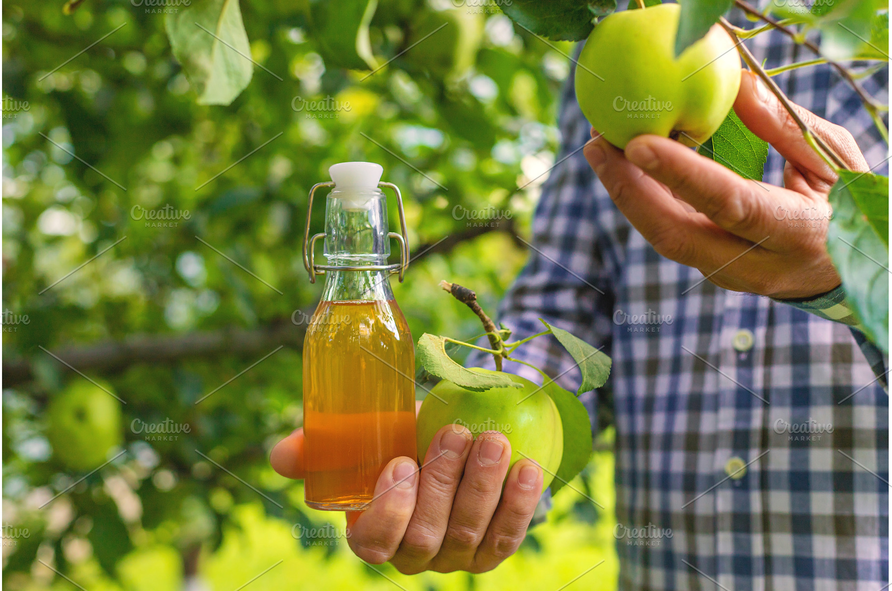 Apple cider vinegar against a, a Food & Drink Photo by yanadjana