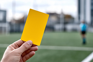 Hand holding a yellow card on soccer, a Sports & Recreation Photo by MistyDay