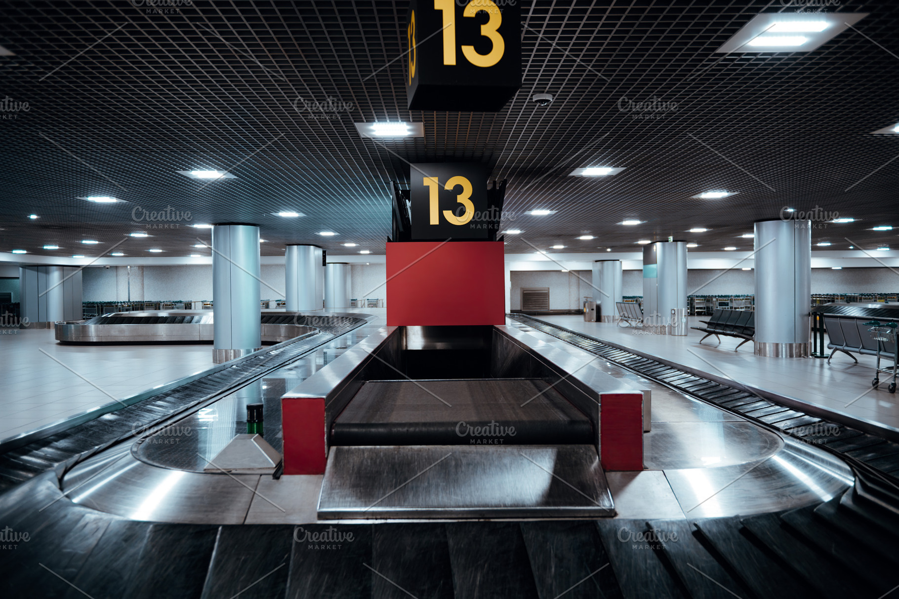 Low-key airport baggage claim hall, a Transportation Photo by SkyNext