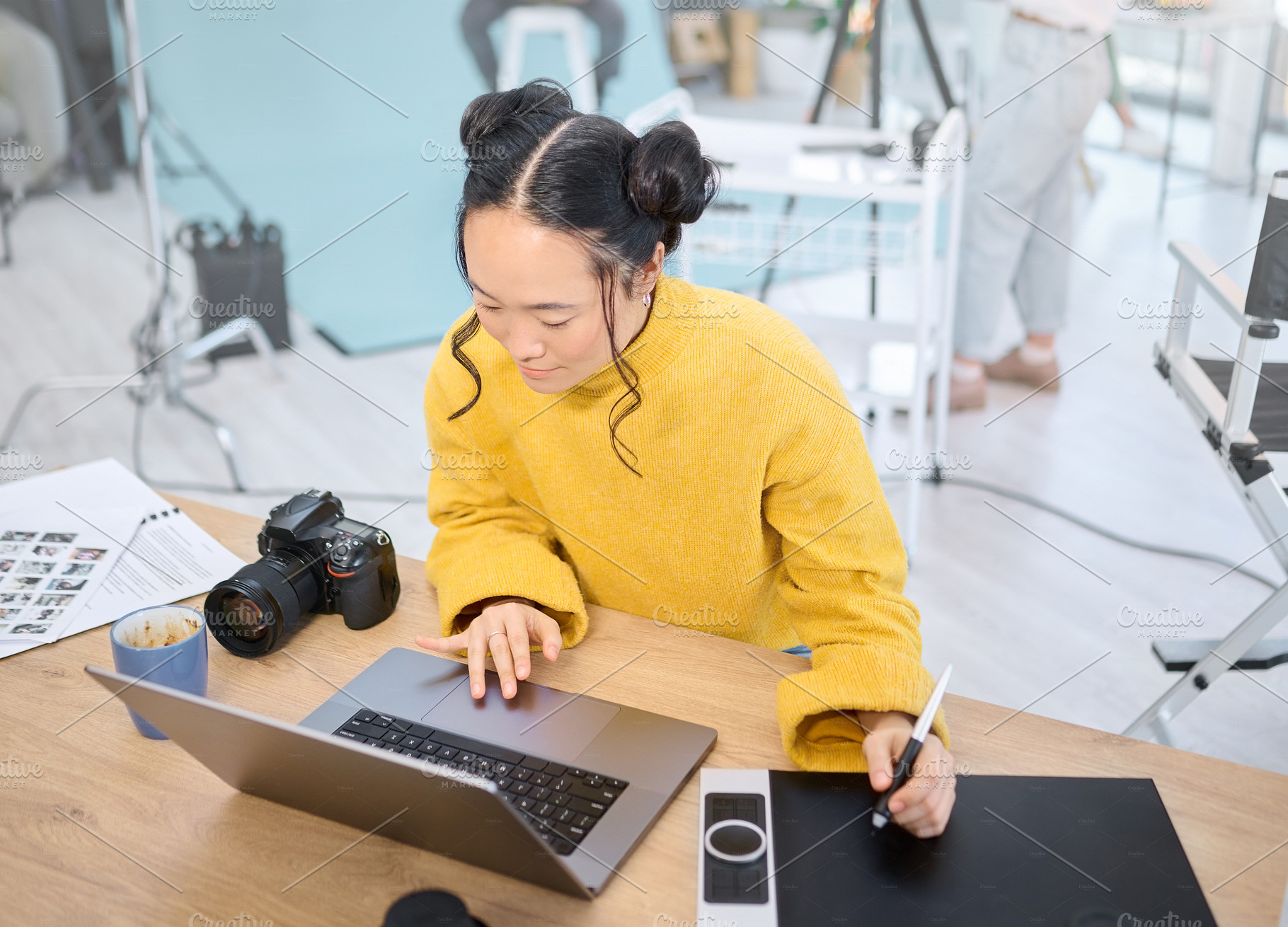 Graphic tablet, laptop and photography woman editing photoshoot, focus on digital art or retouching artistic photo. Design pen, creative and top view of Asian photographer working on camera process, a Photo by Peopleimages.com