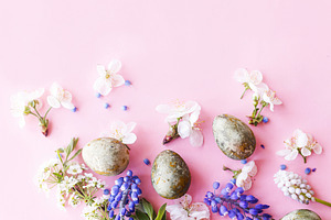 Happy Easter! Easter eggs with cherry blossom flat lay on pink b, a Holiday Photo by Sonjachni