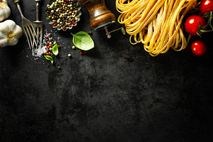 Italian food background with ingredi containing gastronomy, dark background