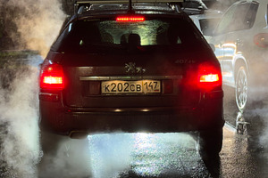 A dark car with fog and steam rising from the ground at night, illuminated by r, an Industrial Photo by Textures & Backgrounds