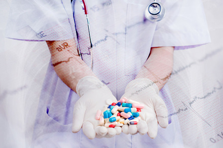 Doctor woman holding pill or medication in capsule. concept of p, a Health & Medical Photo by Casanowe-studio