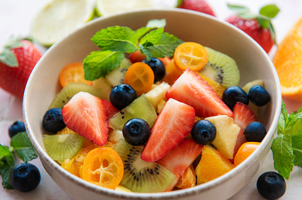 Healthy fresh fruit salad in a bowl, a Food & Drink Photo by Olena Rudo