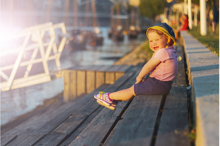 happy child near the river at sunset, a Nature Photo by Pakosta