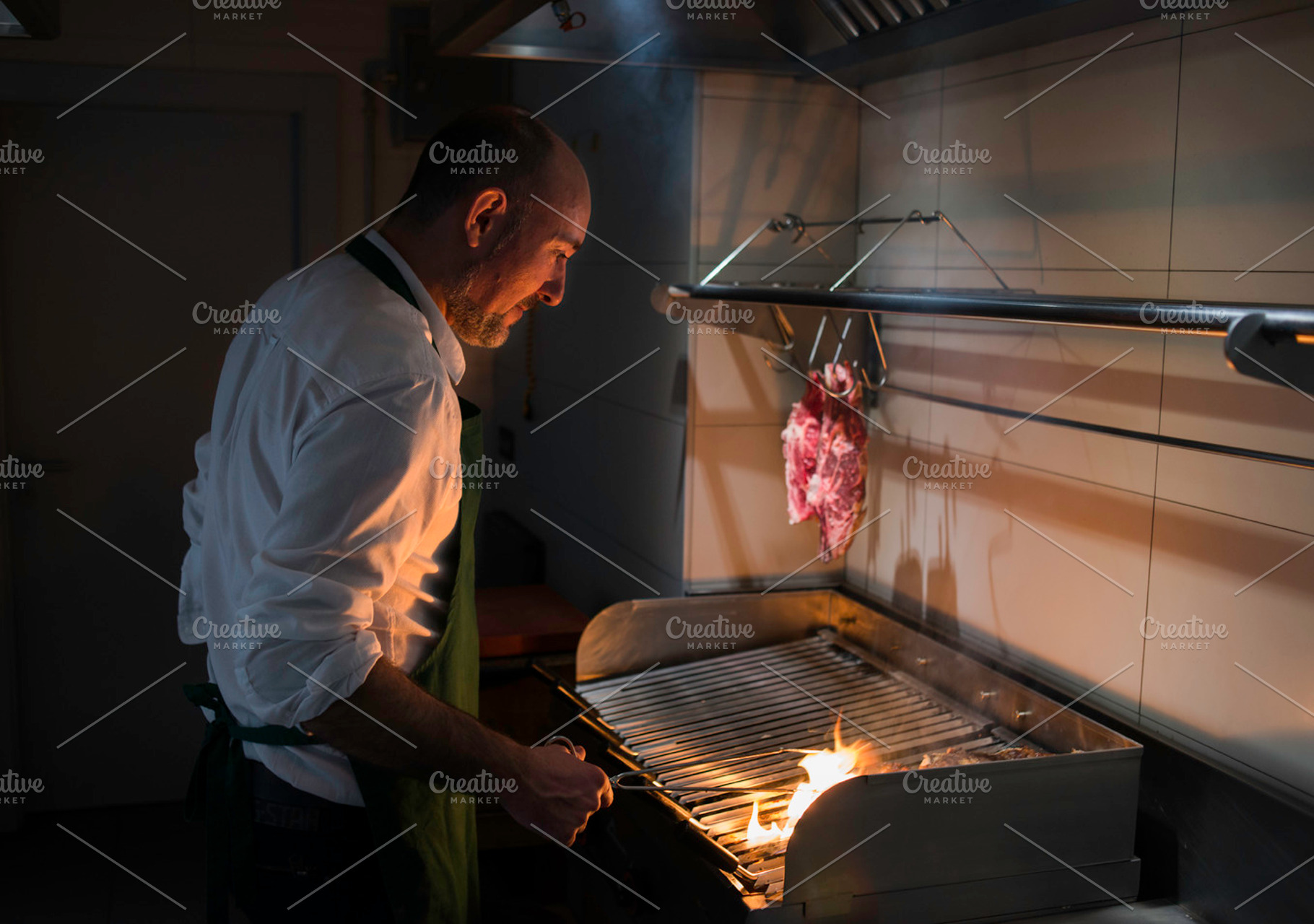 Chef at work featuring cooking, man, and barbecue, a Food & Drink Photo by inigocia