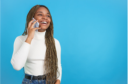 Happy african woman talking on the, a Person Photo by Iván Moreno STOCK PHOTO