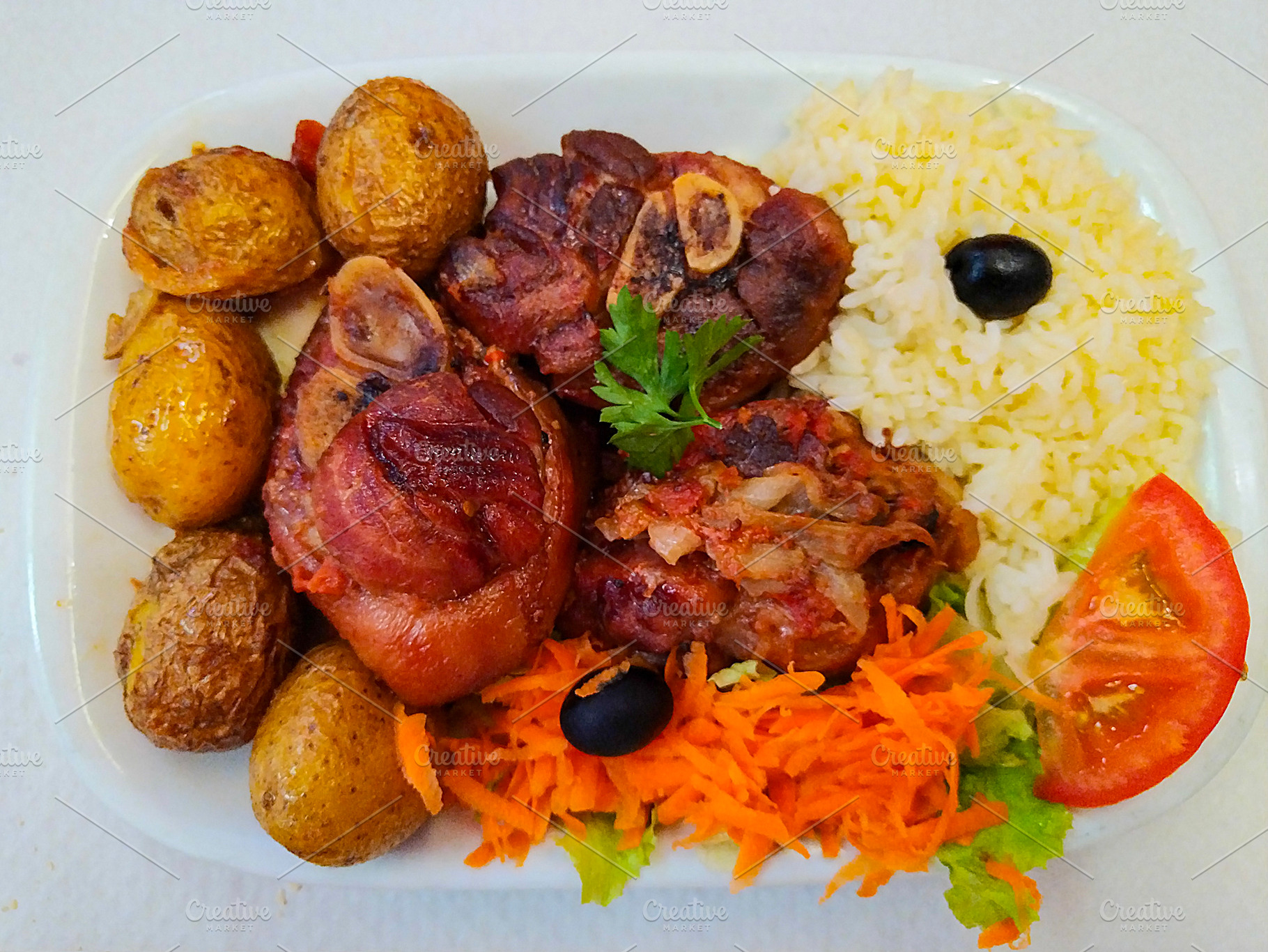 Hearty portuguese pork knuckle meal, a Food & Drink Photo by DanFLCreativo