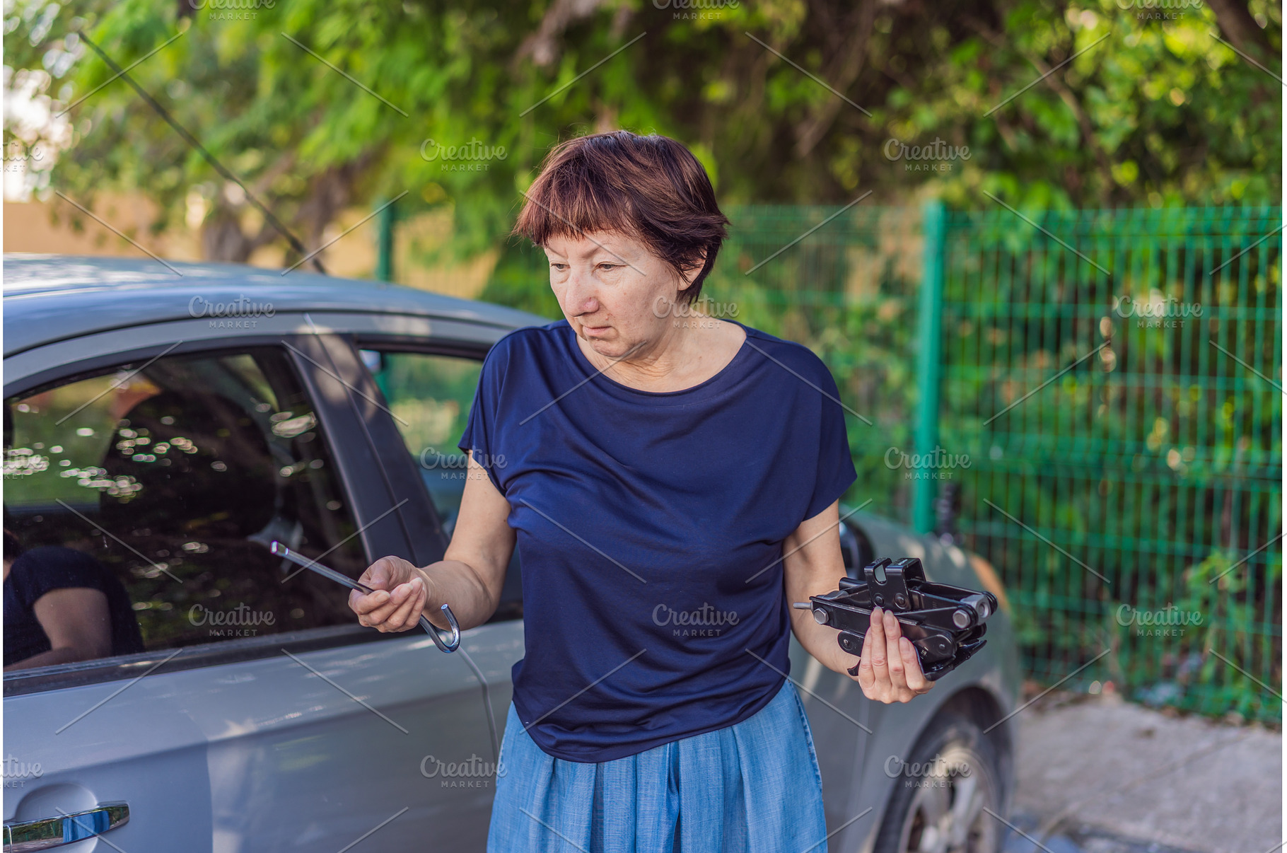 Older woman standing outdoors, a Person Photo by Elizaveta Galitskaya