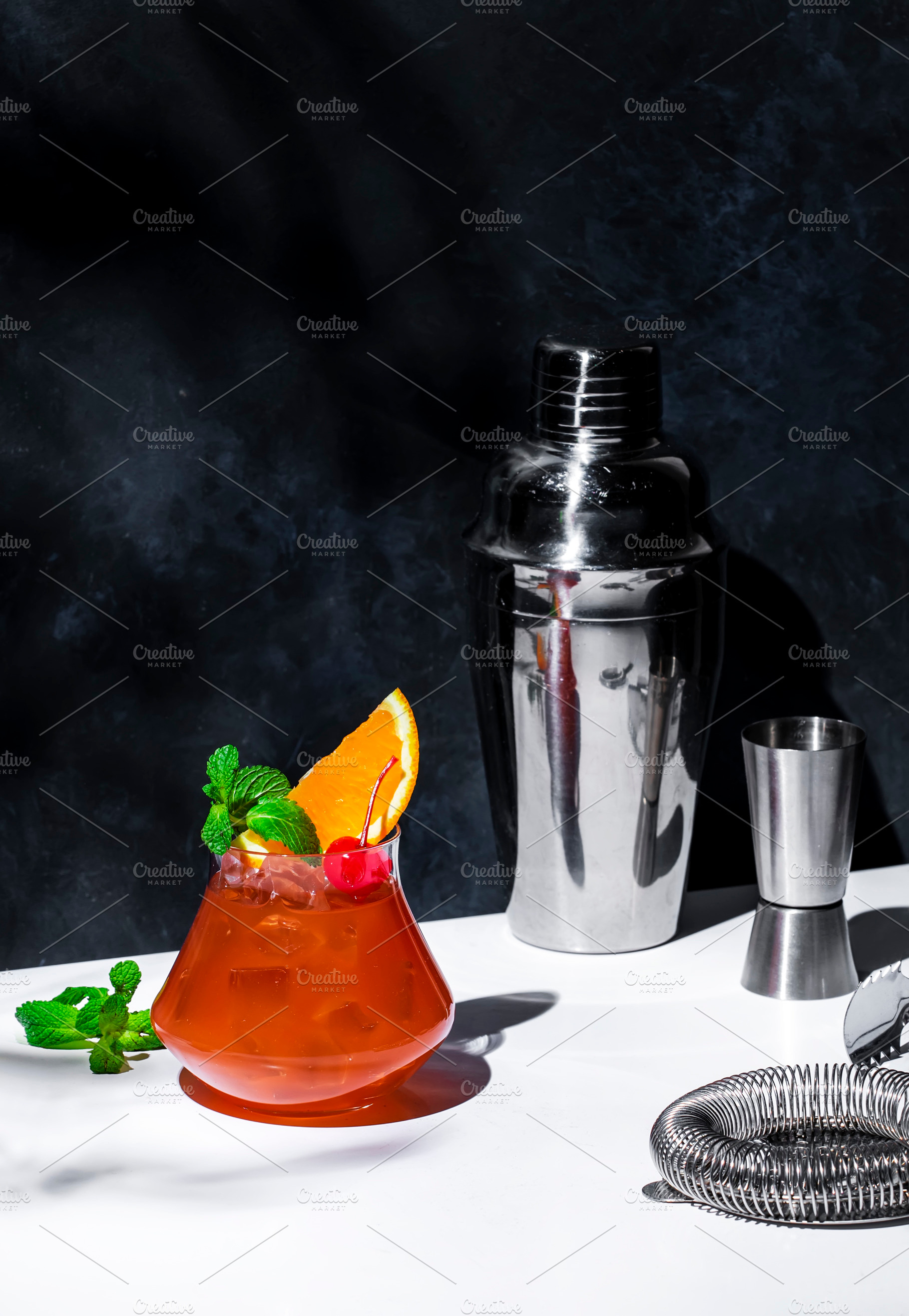 Red fruit cocktail drink with rum, pineapple juice, ssrop, orang, a Food & Drink Photo by 5PH