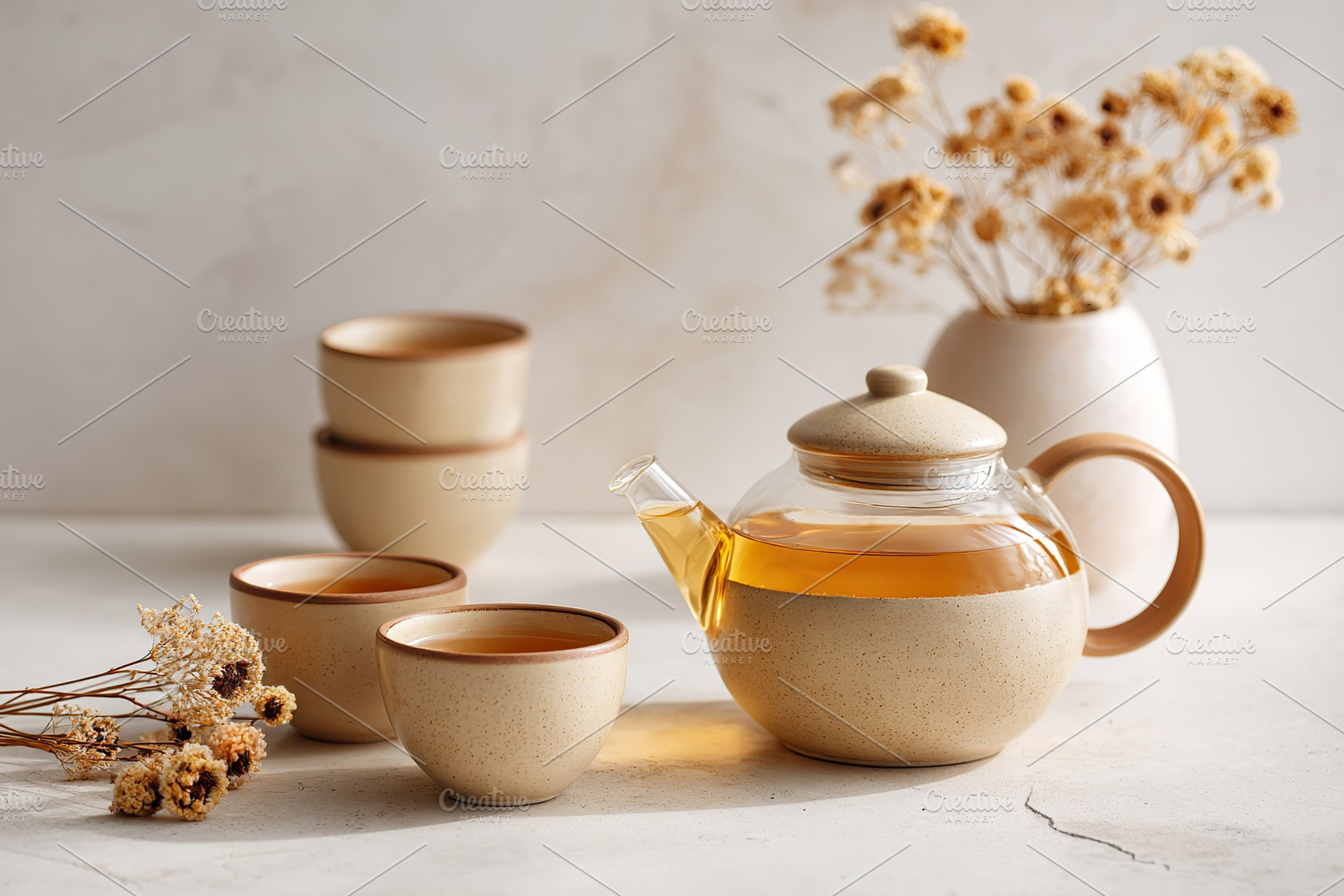 Elegant glass teapot with ceramic cups on a minimalist table setting in a seren, a Food & Drink Photo by AlyaAnd