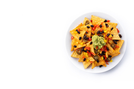 Mexican nachos tortilla chips with black beans, guacamole, tomato and jalapeno, a Background Photo by etorres69