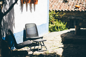 Rustic patio with wicker chairs, an Architecture Photo by SkyNext