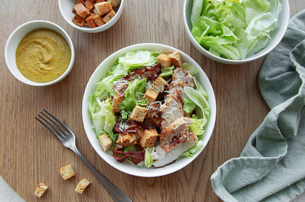 A bowl  of  Caesar salad, a Photo by Olena Rudo