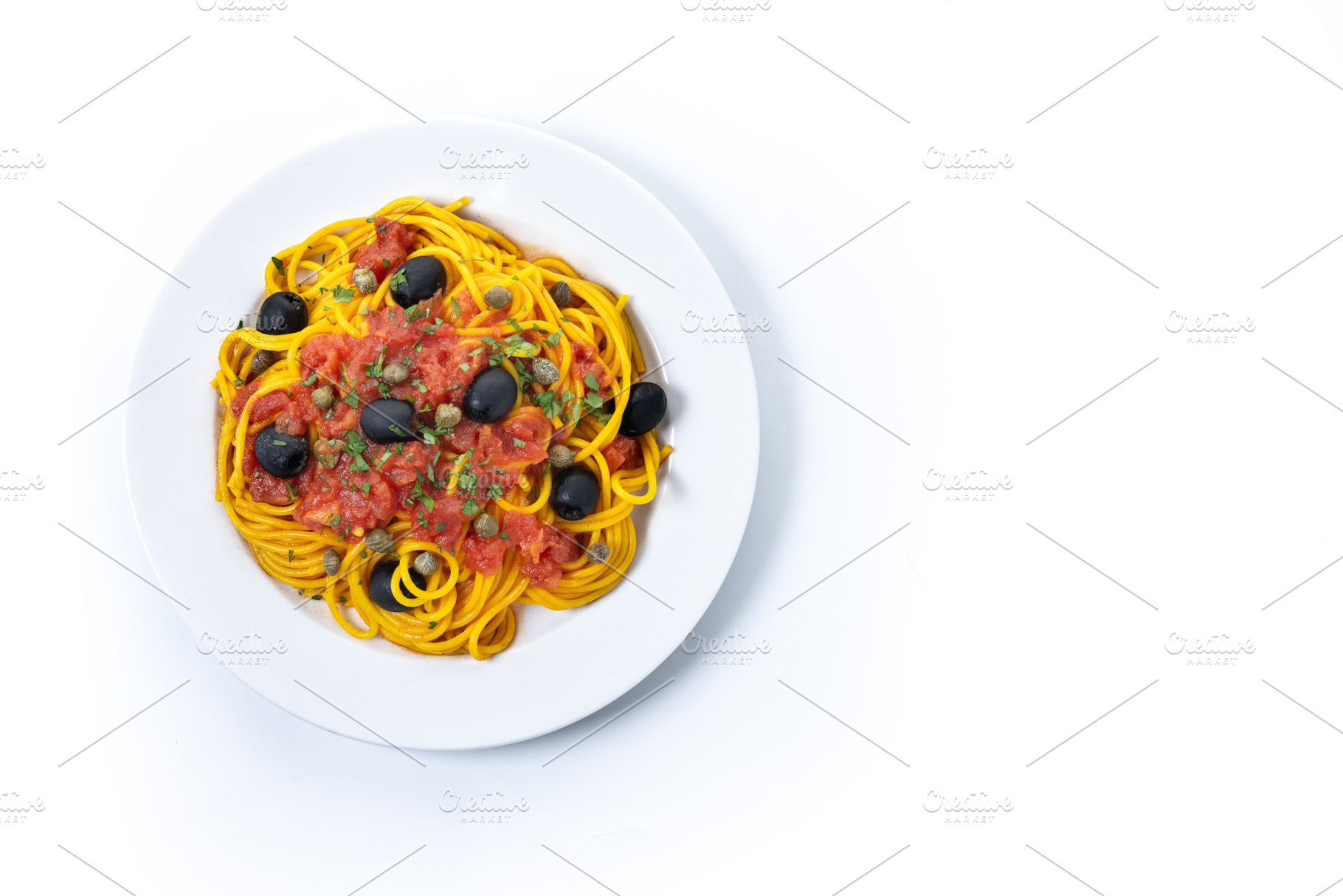 Italian Pasta puttanesca with tomato sauce, capers, and black ol, a Food & Drink Photo by etorres69