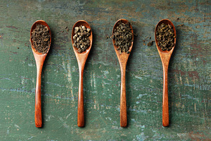 Assortment of Loose Leaf Teas in Wooden Spoons on Rustic Backgro, a Food & Drink Photo by Natalia Klenova's Shop