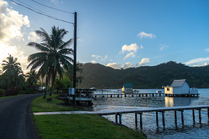 Sunset at Hurepiti Bay with Stilt Houses on Tahaa Island, an Architecture Photo by GoodGoods