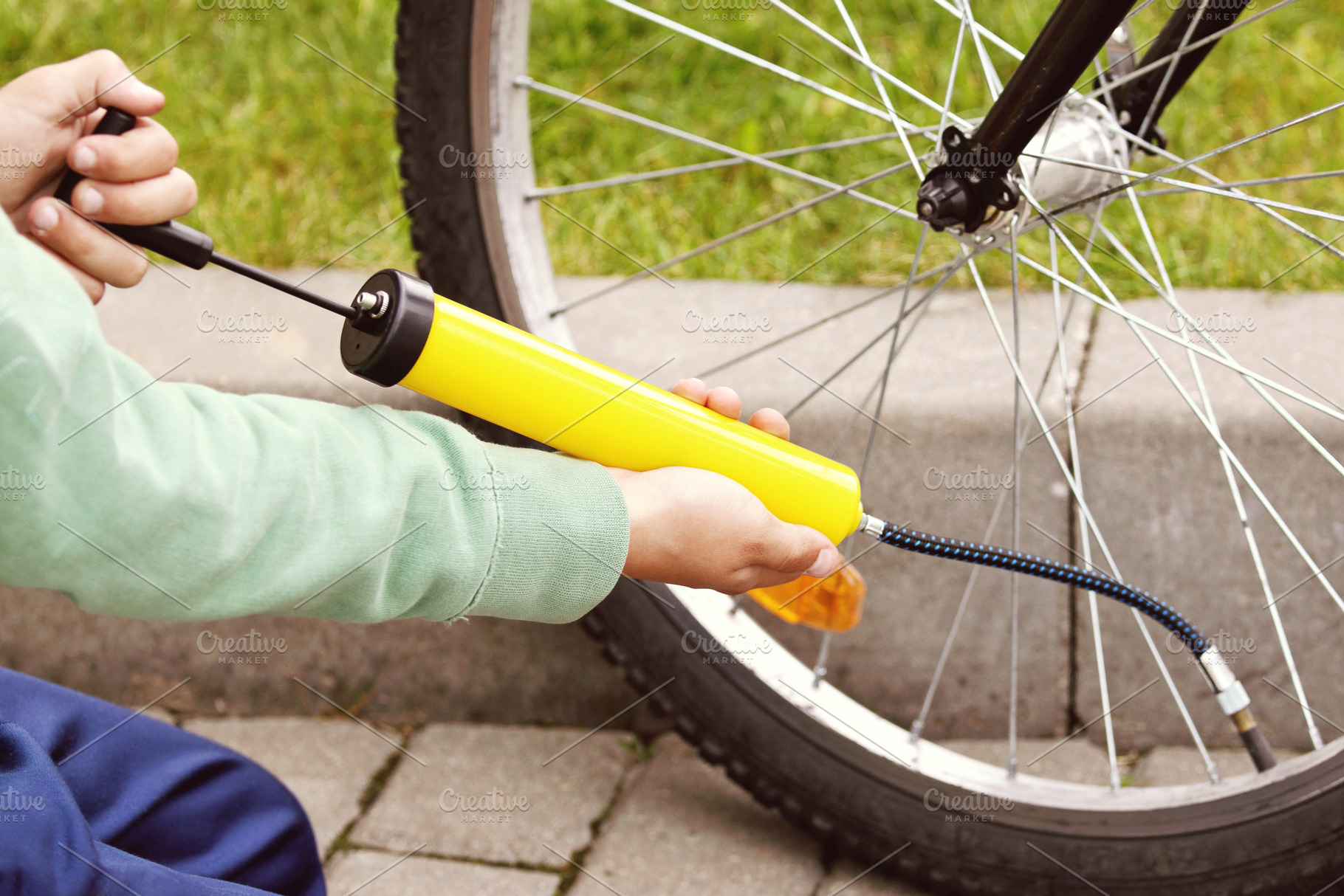 Hands pumping bicycle tire, a Sports & Recreation Photo by BOOCYS