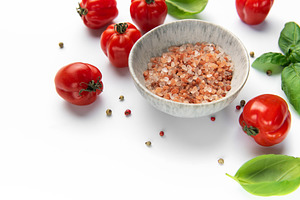 Himalayan pink salt in bowl with fresh organic tomatoes and basi, a Food & Drink Photo by Olena Rudo