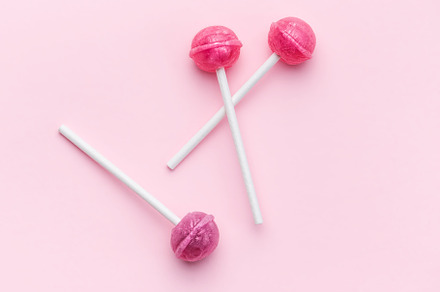 Sweet lollipops on pink background, a Food & Drink Photo by Olena Rudo