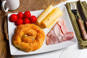 Savory breakfast with ham, cheese, tomatoes and rosemary brioche, a Food & Drink Photo by Antonio Gravante Market