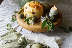 Easter celebration. Stylish green easter eggs in bunny ears napk, a Holiday Photo by Sonjachni