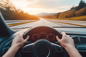 Hands gripping steering wheel while driving on an open road duri, a Transportation Photo by AlyaAnd