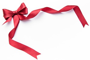 Red satin ribbon bow framing white background, a Holiday Photo by Olena Rudo