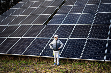 Boy child on the background of solar panels.  Eco energy., a Technology Photo by AS photostudio