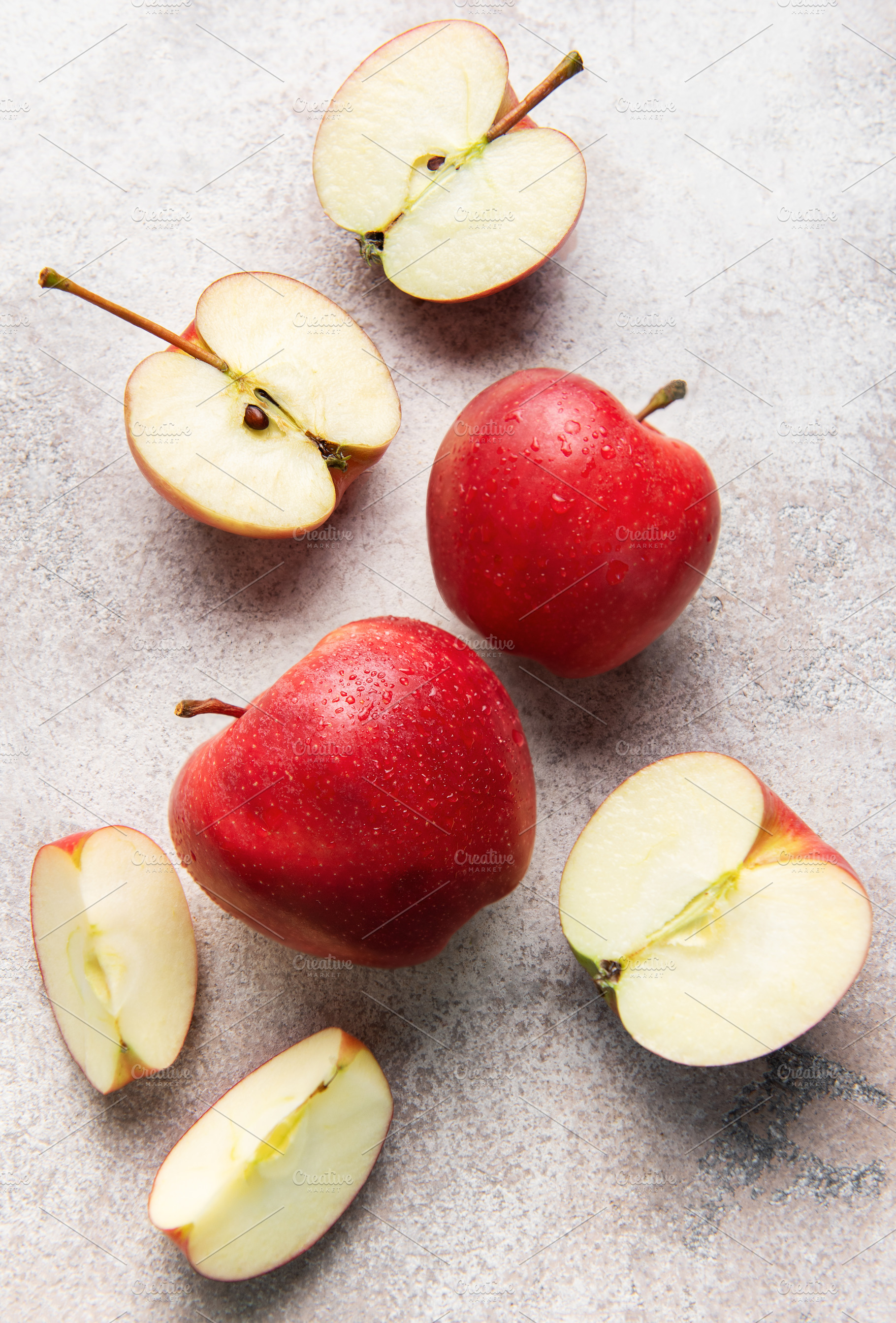 Ripe red apples whole and sliced fresh fruit, a Food & Drink Photo by Olena Rudo