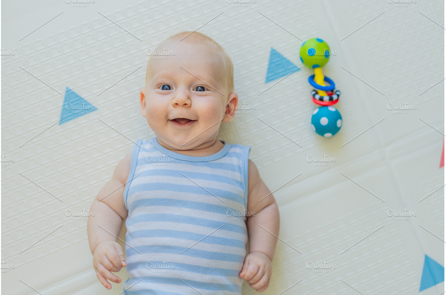 Adorable baby playing with colorful, a Person Photo by Elizaveta Galitskaya