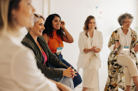 Multicultural businesswomen having a conference meeting in an of, a Person Photo by Jacob Lund