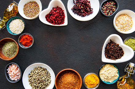 Various spices in a bowls on a black, a Food & Drink Photo by Olena Rudo