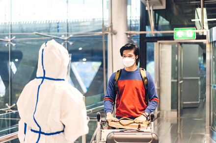 Doctor woman use infrared forehead thermometer for check body te, a Person Photo by Art_Photo