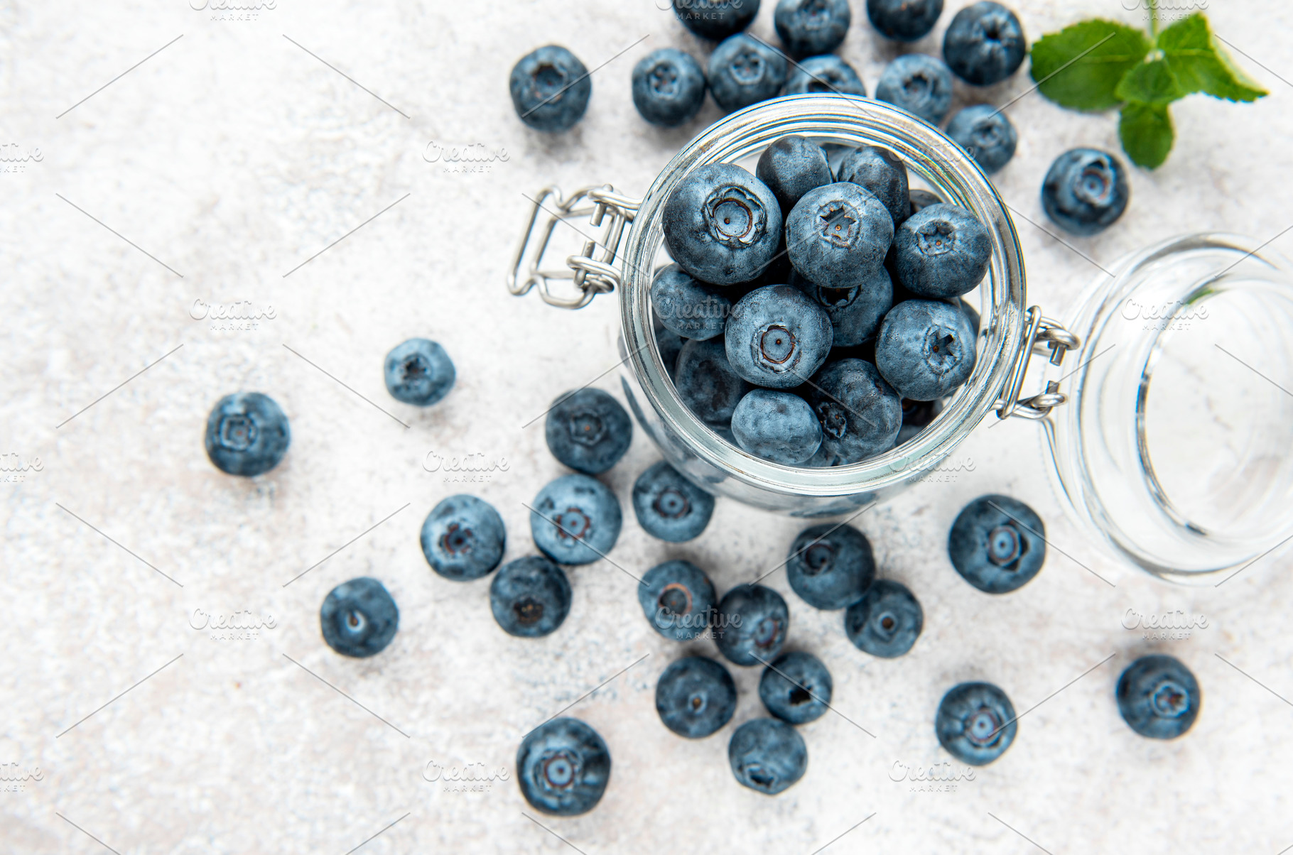 Blueberries on concrete background, a Food & Drink Photo by Olena Rudo