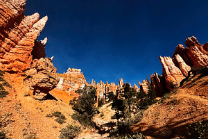 Dramatic orange hoodoo formations under a deep blue sky in Utah canyon landscap, a Nature Photo by AS photostudio