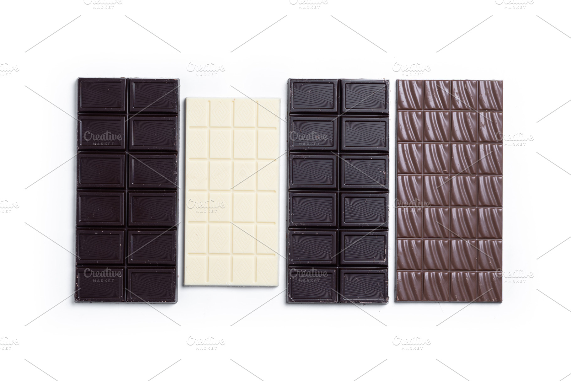 Assortment of white, milk and dark chocolate pieces, a Photo by etorres69